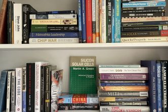 Two rows of books on shelves