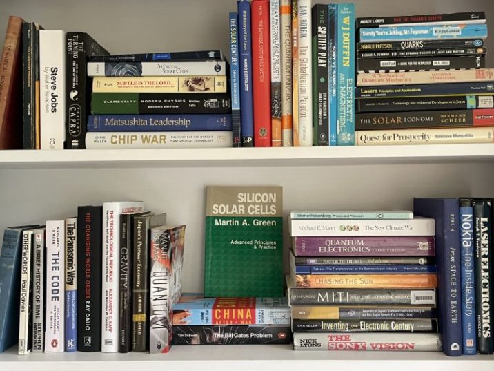Two rows of books on shelves